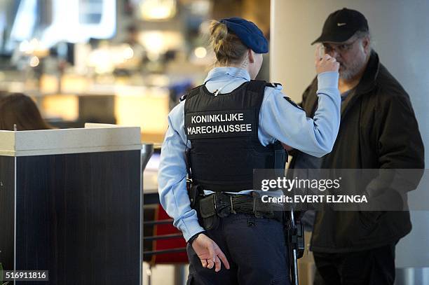 The military police carries extra patrols at Schiphol Airport in Amsterdam, on March 22, 2016 in response to the attacks in the departure hall of...