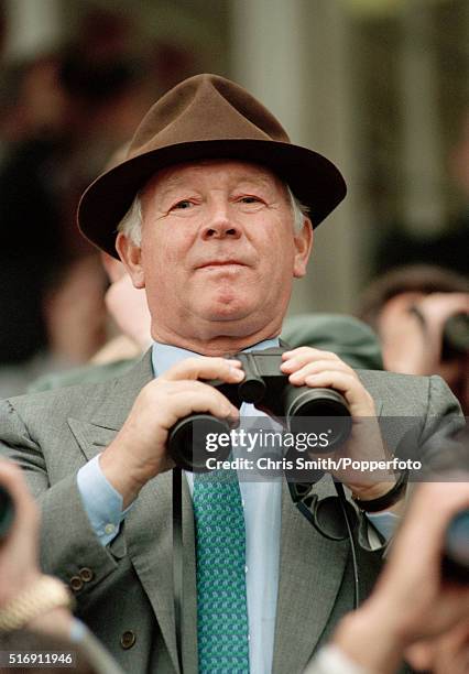 Businessman and racehorse owner, Robert Sangster, watching the racing at Newmarket, circa July 1994.