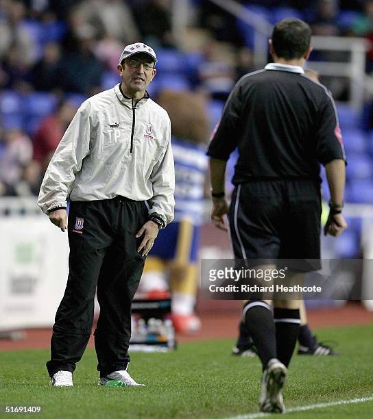Stoke manager Tony Pulis talks to the referee during the Coca-Cola Championship match between Reading and Stoke City at the Madejski Stadium on...