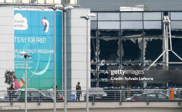 Military guard the area as passengers are evacuated from Zaventem Bruxelles International Airport after a terrorist attack on March 22, 2016 in...