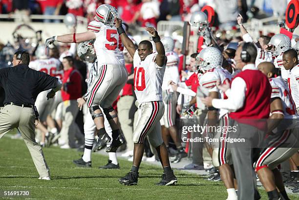 Troy Smith of Ohio State celebrates after his defensive teammates intercepted the ball late in the fourth quarter against Michigan State at Spartan...