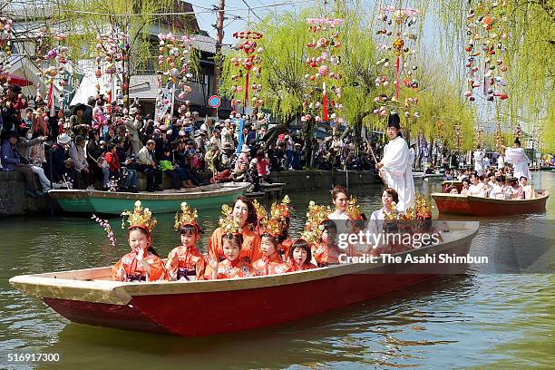 Boats carrying girls wearing traditional kimono cruise a canal during the Hina Matsuri River Parade on March 20, 2016 in Yanagawa, Fukuoka, Japan.