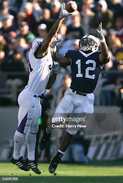 Michael Robinson of Penn State has the ball knocked away from him by Paul Posluszny of Northwestern in the third quarter at Beaver Stadium on...