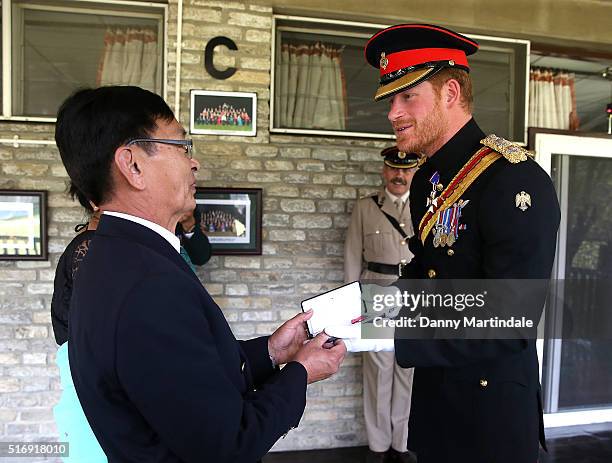 Prince Harry awards a MBE to Bhaktabahadur Rai for bringing safe water to 39 districts of Nepal on March 22, 2016 in Pokhara, Nepal.