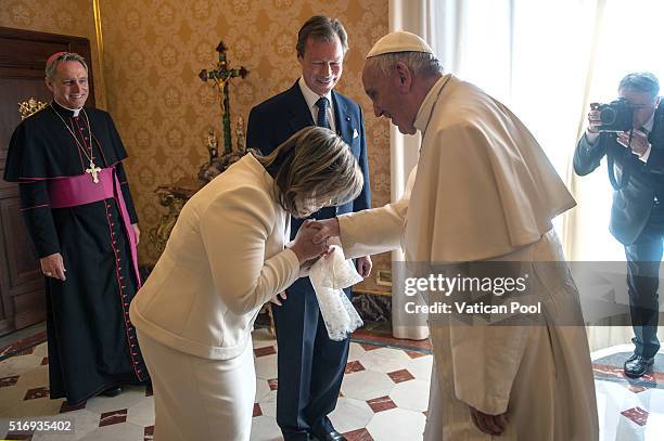 Pope Francis meets Grand Duchess Maria Teresa and Grand Duke Henri of Luxembourg at his private library in the Apostolic Palace on March 21, 2016 in...