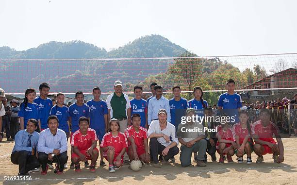 Prince Harry plays volleyball with local school children as he visits Gauda Secondary School, an earthquake-damaged school being reconstructed with...