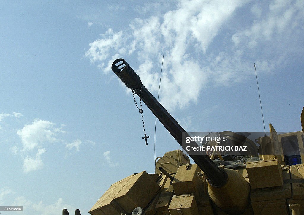 A rosary hangs off the barrel of a machi