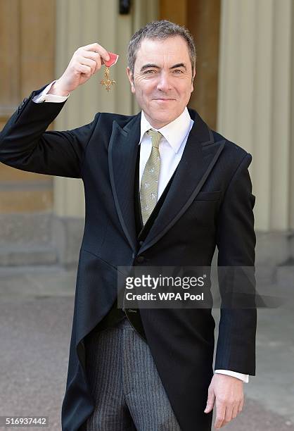 Actor James Nesbitt with the OBE he was awarded by Queen Elizabeth II during an Investiture ceremony for services to drama and to the community in...