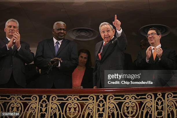 Cuban President Raul Castro acknowledges applause while joining Cuban Vice President Miguel Díaz-Canel, Cuban Parliamentarian Esteban Lazo Hernandez...