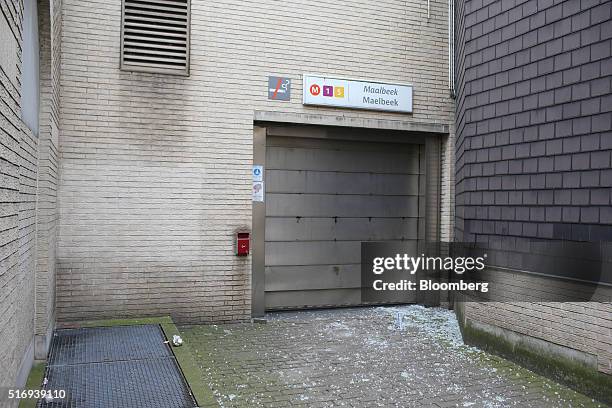 Fragments of glass cover the ground outside a shuttered entrance to Maelbeek metro station following a bomb attack in Brussels, Belgium, on Tuesday,...