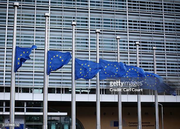 The European Union flag flies at half mast outside EU Commission Headquarters following todays attack on March 22, 2016 in Brussels, Belgium. At...