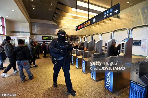 New York Police Department officer patrols in a subway station on March 22 in New York. New York and Washington stepped up security in the wake of...
