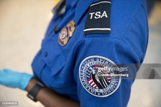 Transportation Security Administration officer stands in the TSA pre-check area at Dulles International Airport in Dulles, Virginia, U.S., on...