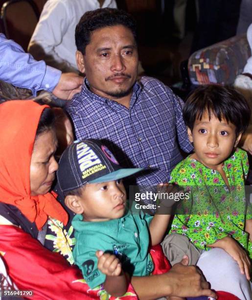 Abdul Jawah Salawat a hostage released by Abu Sayyaf rebels in the southern Philippines is reunited with his wife, Norsimah Musbani , one-year-old...
