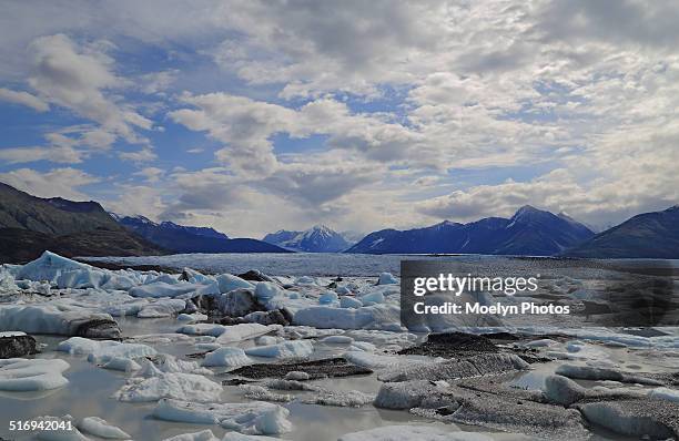 clouds cover the knik glacier - knik glacier stock pictures, royalty-free photos & images