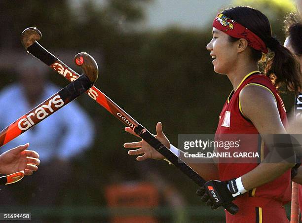 Chinese Chen Quiqi celebrates after scoring against New Zealand during her 100 field hockey match played for the China National Team at the Champions...