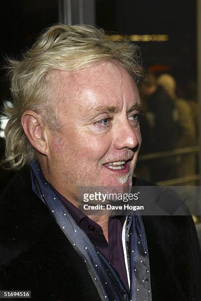Musician Roger Taylor arrives at the premiere screening of the new four-disc DVD featuring 10 hours of footage from the historic charity concert...