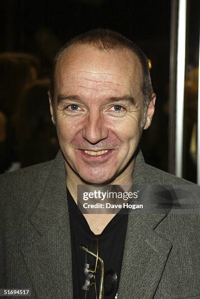 Musician Midge Ure arrives at the premiere screening of the new four-disc DVD featuring 10 hours of footage from the historic charity concert "Live...