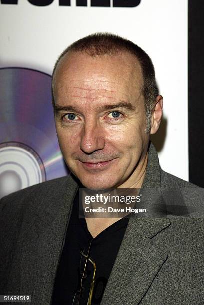 Musician Midge Ure arrives at the premiere screening of the new four-disc DVD featuring 10 hours of footage from the historic charity concert "Live...