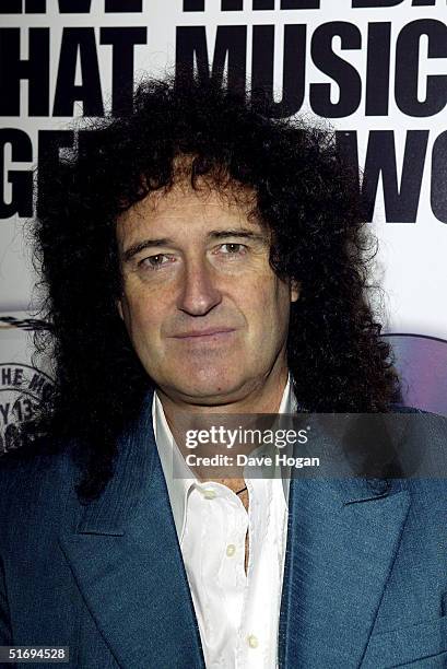 Musician Brian May arrives at the premiere screening of the new four-disc DVD featuring 10 hours of footage from the historic charity concert "Live...