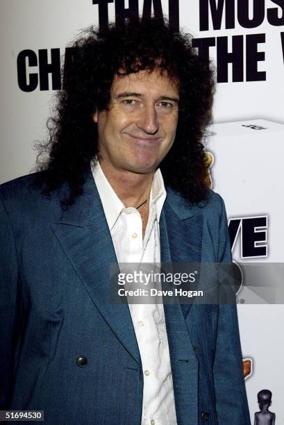Musician Brian May arrives at the premiere screening of the new four-disc DVD featuring 10 hours of footage from the historic charity concert "Live...