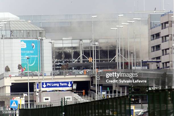 Plume of smoke rises over Brussels airport after the controlled explosion of a third device in Zaventem Bruxelles International Airport after a...