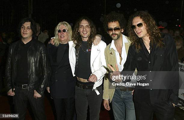 Music producer Roy Thomas Baker and members of The Darkness Ed Graham, Justin Hawkins, Frankie Poullain and Dan Hawkins arrive at the premiere...