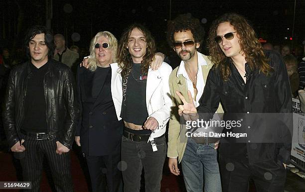 Music producer Roy Thomas Baker and members of The Darkness Ed Graham, Justin Hawkins, Frankie Poullain and Dan Hawkins arrive at the premiere...