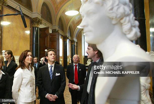 Danish Crown Prince Frederik and Princess Mary look at a bust of Christian Daniel Rauch by Danish sculptor Bertel Thorvaldsen at Berlin's Alte...