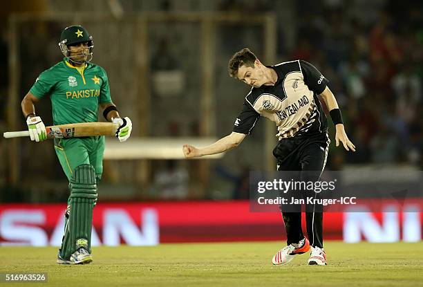 Adam Milne of New Zealand celebrates the wicket of Umar Akmal of Pakistan during the ICC World Twenty20 India 2016 Super 10s Group 2 match between...