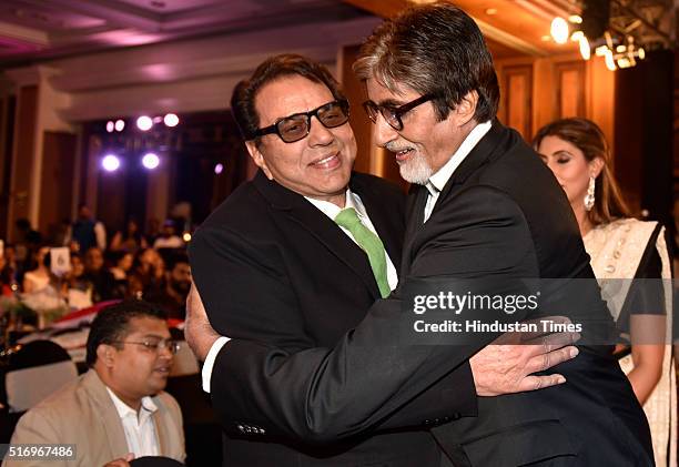 Bollywood actor Amitabh Bachchan hugs Dharmendra during Hindustan Times Most Stylish Awards 2016 at Taj Lands End, Bandra on March 20, 2016 in...