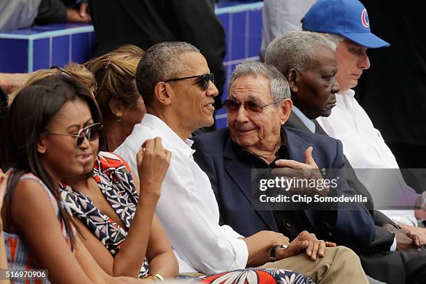 Sasha Obama, U.S. First lady Michelle Obama, President Barack Obama and Cuban President Raul Castro attend an exhibition game between the Cuban...