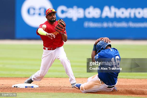 Oscar Angulo of Team Spain turns a double play during Game 1 of the World Baseball Classic Qualifier against Team Colombia at Rod Carew Stadium on...