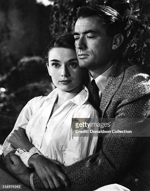 Actress Audrey Hepburn and actor Gregory Peck pose for a publicity still for the Paramount Pictures film 'Roman Holiday' in 1953 in Rome, Italy.
