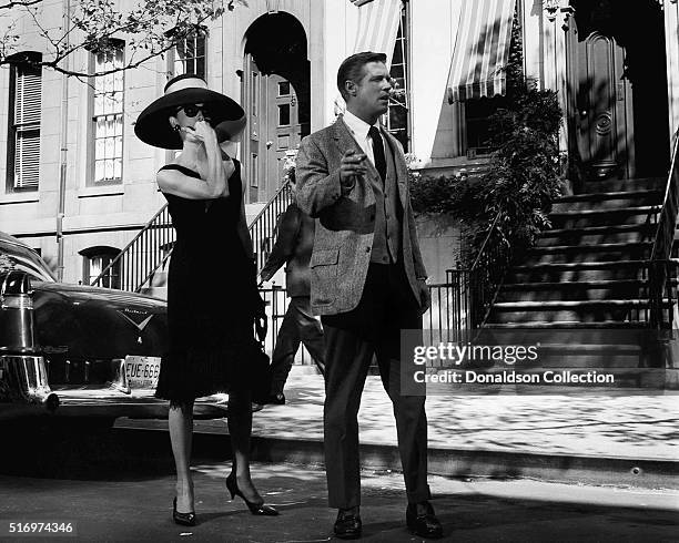 Actress Audrey Hepburn and actor George Peppard pose for a publicity still for the Paramount Pictures film 'Breakfast at Tiffany's' in 1961 in New...
