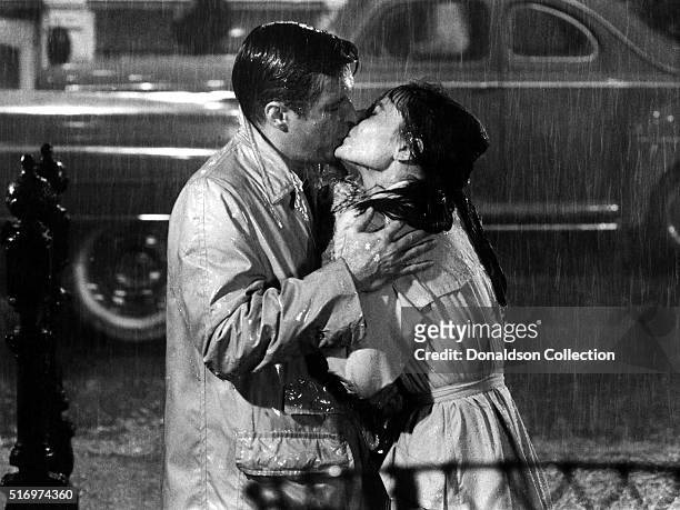 Actress Audrey Hepburn and actor George Peppard pose for a publicity still for the Paramount Pictures film 'Breakfast at Tiffany's' in 1961 in New...