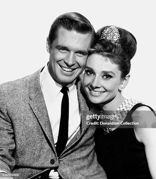 Actress Audrey Hepburn and actor George Peppard pose for a publicity still for the Paramount Pictures film 'Breakfast at Tiffany's' in 1961 in New...