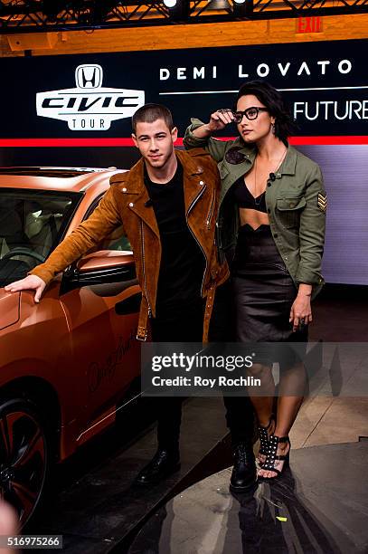 Demi Lovato and Nick Jonas attend the Honda Civic Tour Artists Announcement and Honda Civic North America Launch Event at the Garage on March 22,...