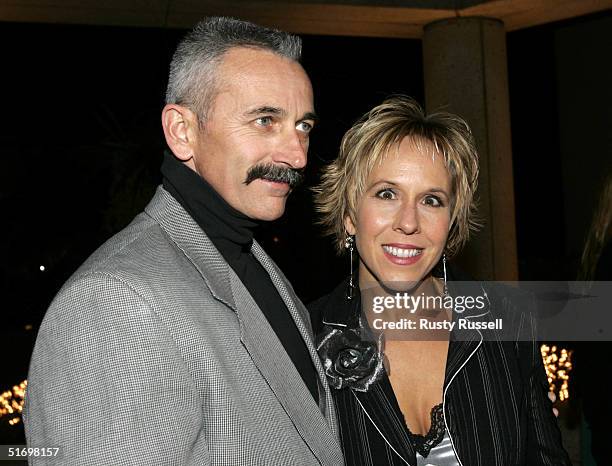 Country music singer Aaron Tippin and guest arrive at the 52nd Annual BMI Country Awards November 8, 2004 in Nashville, Tennessee.