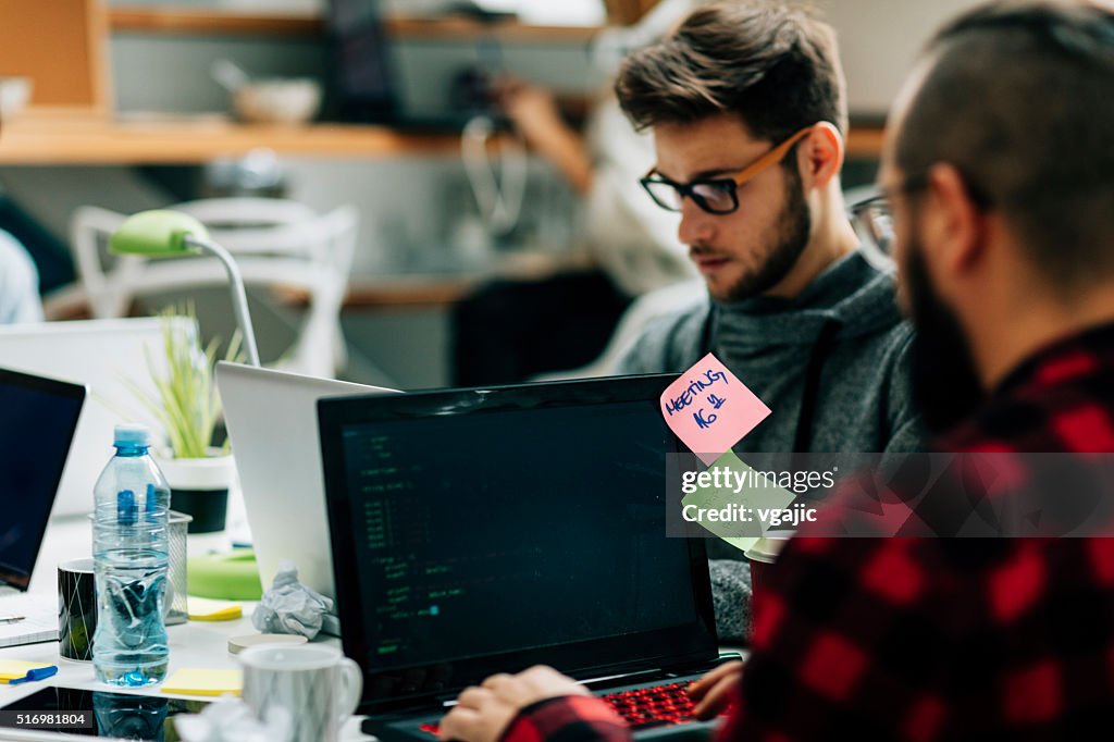 Young Developers Working In Their Office.