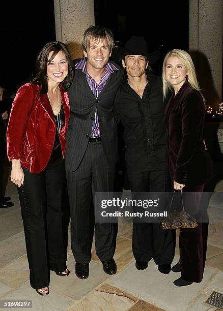 Scott Reeves and Aaron Benward of Blue County and guest arrive at the 52nd Annual BMI Country Awards November 8, 2004 in Nashville, Tennessee.