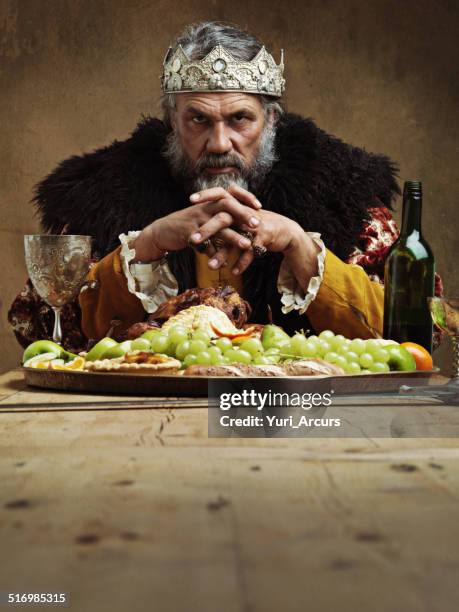 he feasts while the serfs starve - man tray food holding stockfoto's en -beelden