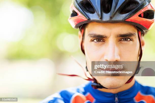 portrait of confident male cyclist - cycling helmet stock pictures, royalty-free photos & images