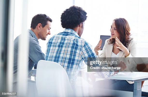 strategizing their way to success - three people stock pictures, royalty-free photos & images