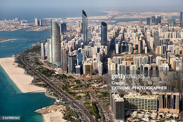 skyscrapers and coastline in abu dhabi - abu dhabi stockfoto's en -beelden