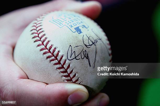 Kotomituki sumo wrestlers holds the autographed ball of Pitcher Roger Clemens of the Houston Astros during the 4nd game of the exhibition series...