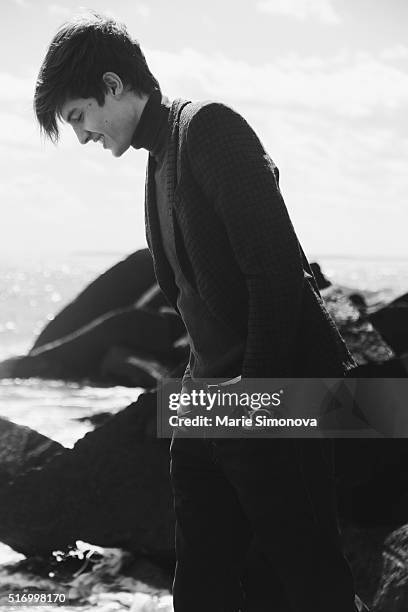 Michael Shmatov wearing Zara Man jacket, Gap turtleneck and Levi's trousers seen on March 21, 2016 in Coney Island, New York City.