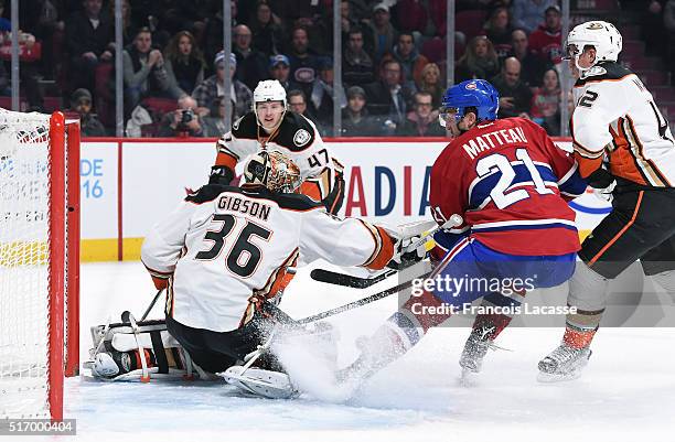 John Gibson of the Anaheim Ducks stops a shot by Stefan Matteau the Montreal Canadiens in the NHL game at the Bell Centre on March 22, 2016 in...