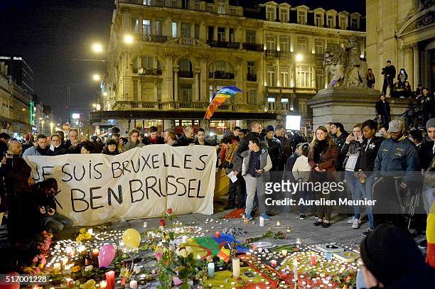 People gather at Place de la Bourse in support of the victims after the terrorist attacks on March 22, 2016 in Brussels, Belgium. At least 31 people...