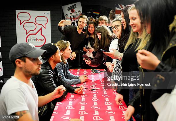 Andy Brown, Ryan Fletcher, Joel Peat and Adam Pitts of Lawson meet fans and sign copies of their new single 'Money' at HMV on March 22, 2016 in...